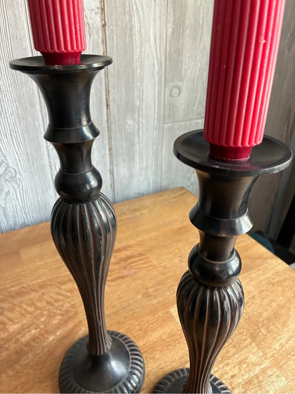 Vintage like Black Metal Candlesticks with Red Ribbed Taper Candles. Very heavy